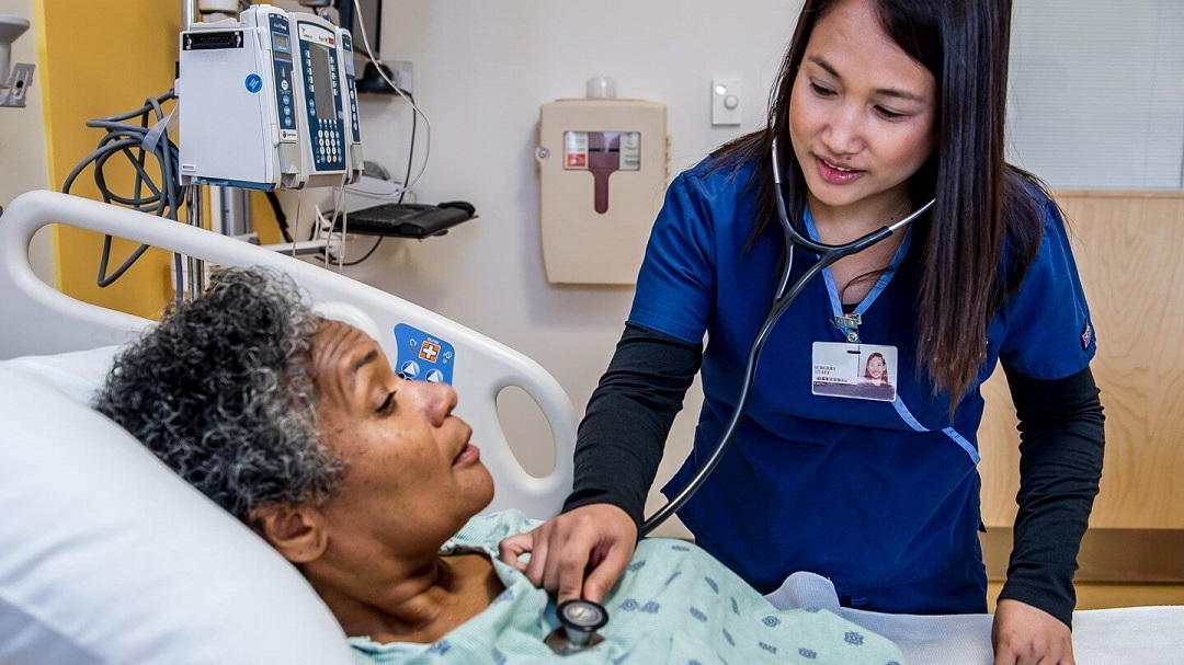 Staff nurse with a patient