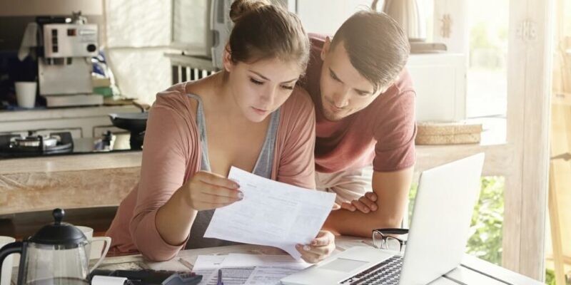 Couple making buying a new house checklist