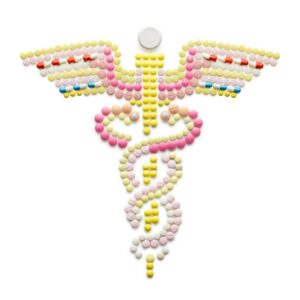 Caduceus symbol made of pills