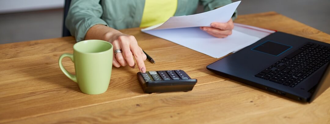 Woman calculating mortgage for recast