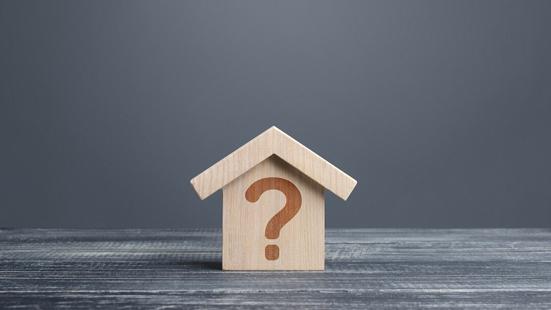 Wooden house icon with a question mark