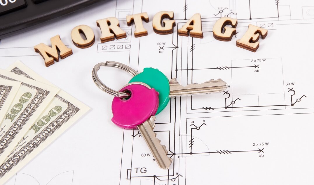 Mortgage keys with money and calculator