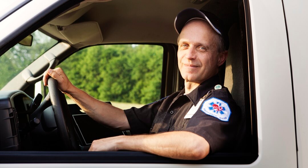 Paramedic sitting in ambulance