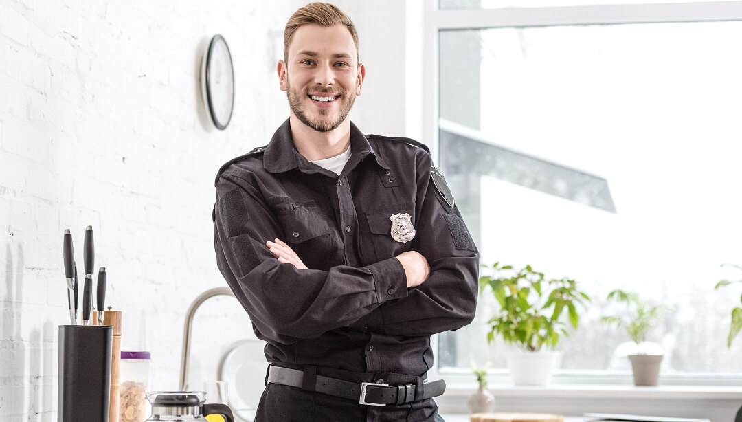 Police officer happy after getting approved on his home loan.