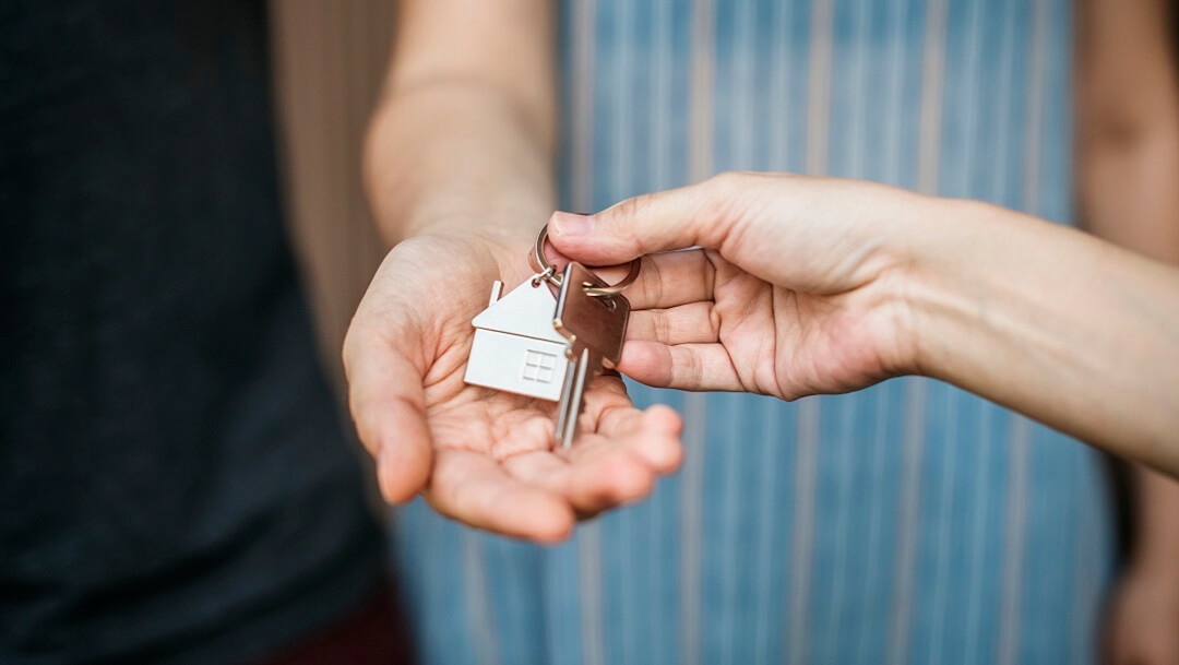 Woman buying a new house with crypto.